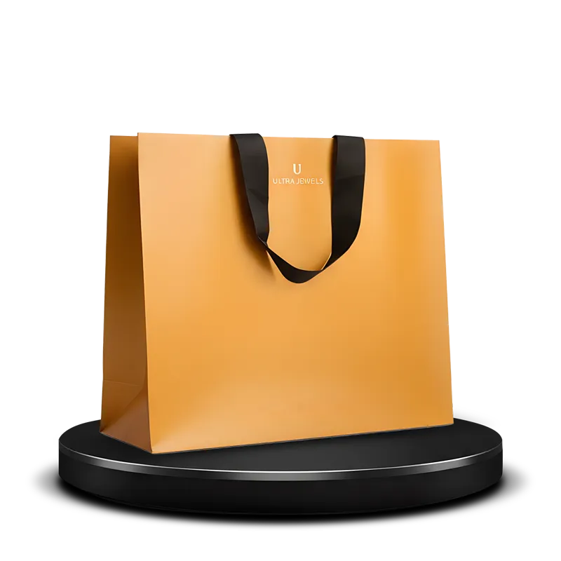 Yellow luxury paper shopping bag custom printed and hot-stamped with logo in gold featuring black ribbon handles
